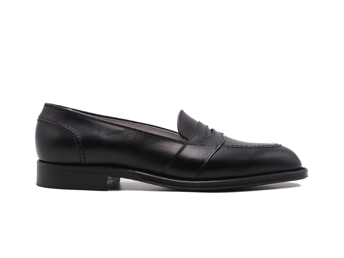 Side view of Alden full strap penny loafer in black calf
