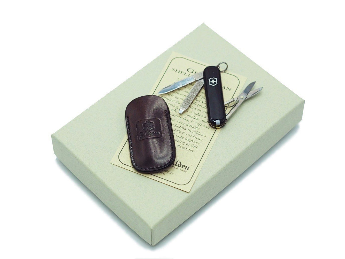 Swiss army knife and Alden color 8 shell cordovan knife case on top of box