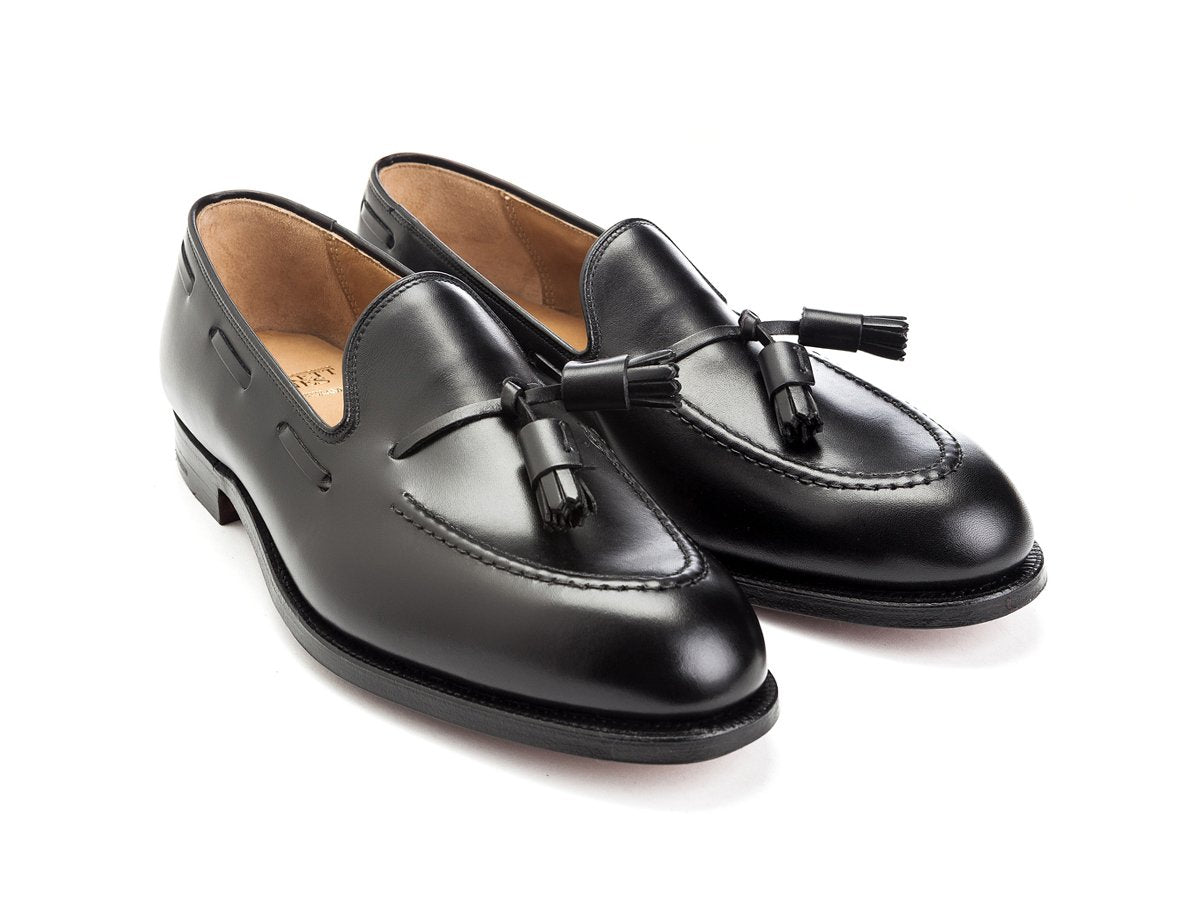 Front angle view of Crockett & Jones Cavendish tassel loafers in black calf