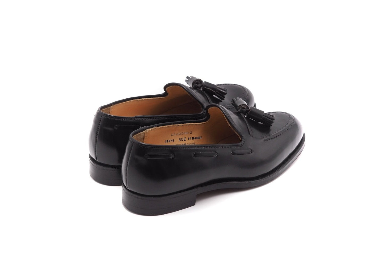 Back angle view of Crockett & Jones Cavendish tassel loafers in black shell cordovan