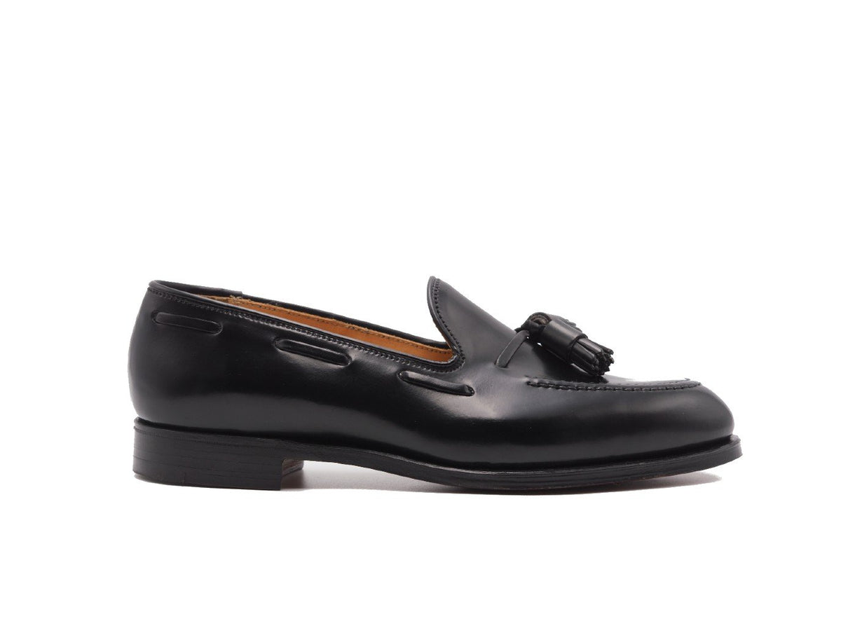 Side view of Crockett & Jones Cavendish tassel loafers in black shell cordovan