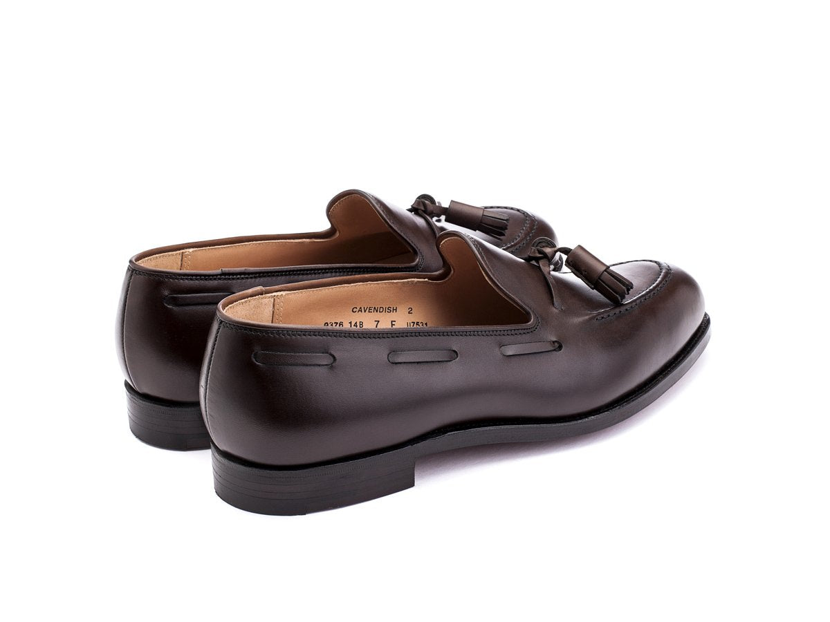 Back angle view of Crockett & Jones Cavendish tassel loafers in dark brown burnished calf