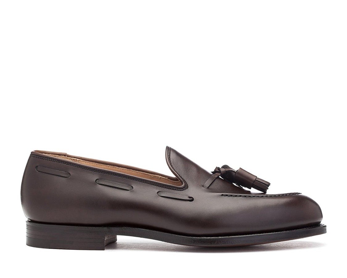 Side view of Crockett & Jones Cavendish tassel loafers in dark brown burnished calf