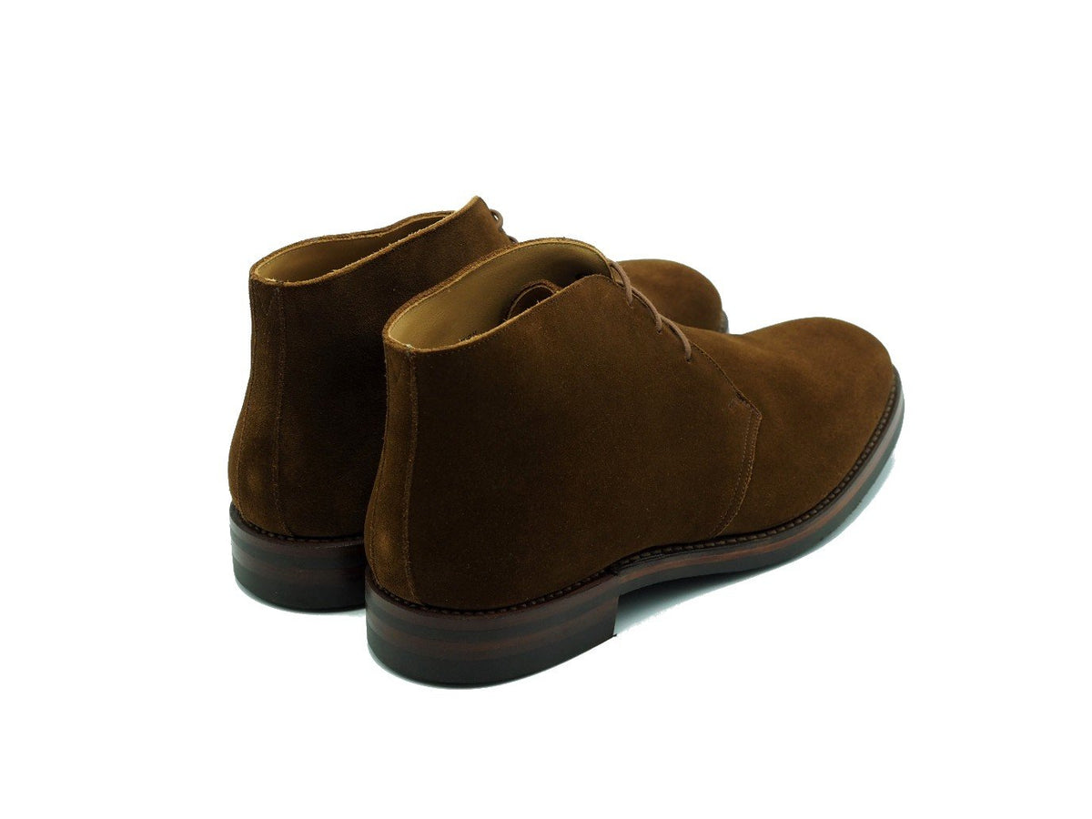 Back angle view of Crockett & Jones Chiltern chukka boots in snuff suede