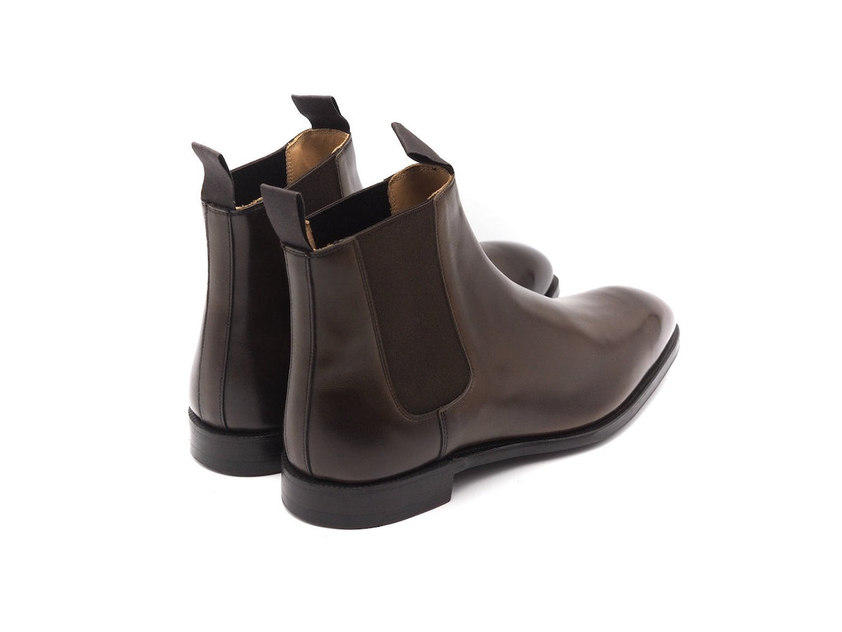 Back angle view of Crockett & Jones Maitland chelsea boots in dark brown antique calf