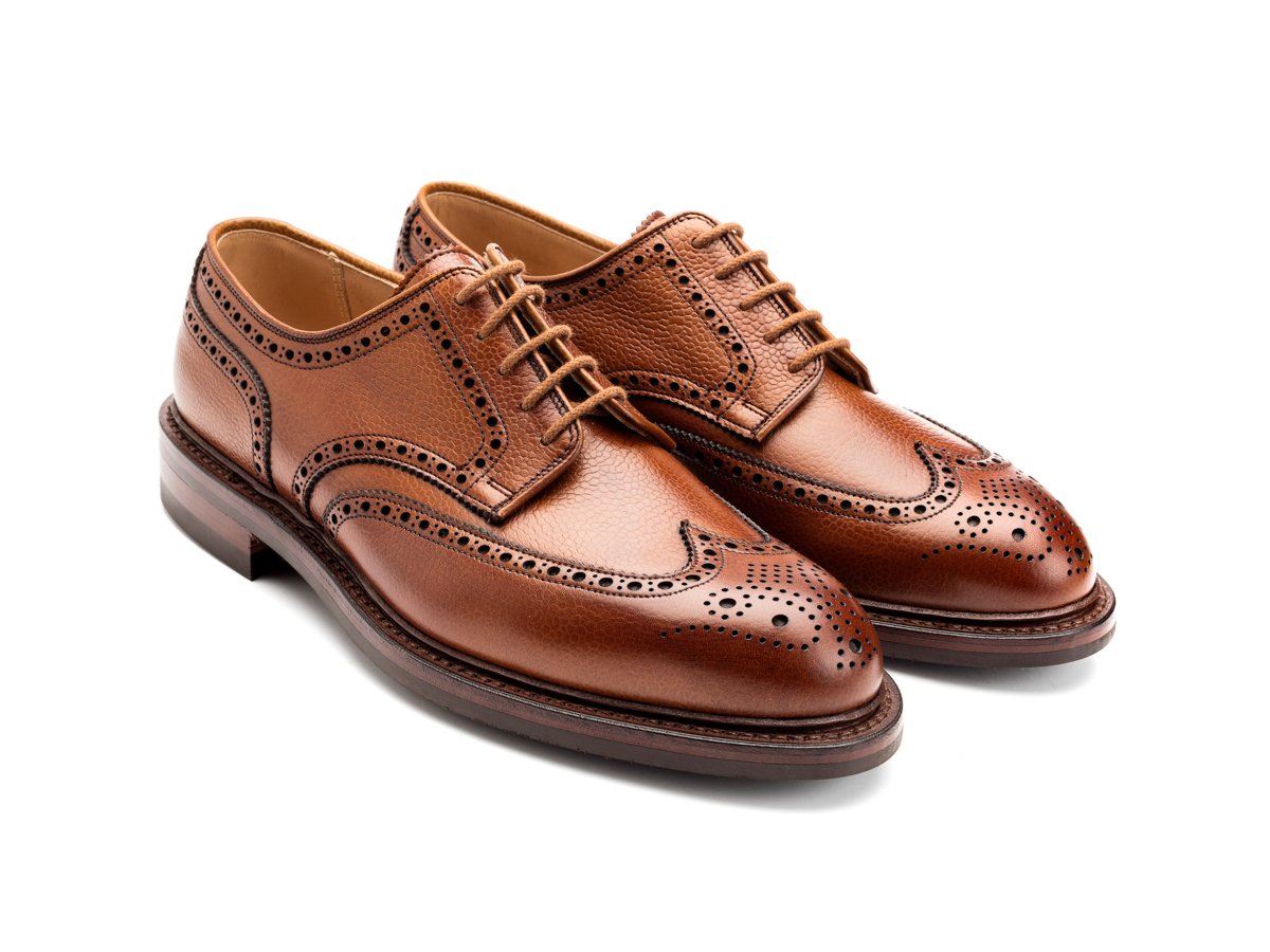 Front angle view of Crockett & Jones Pembroke wingtip full brogue derby shoes in tan scotch grain calf