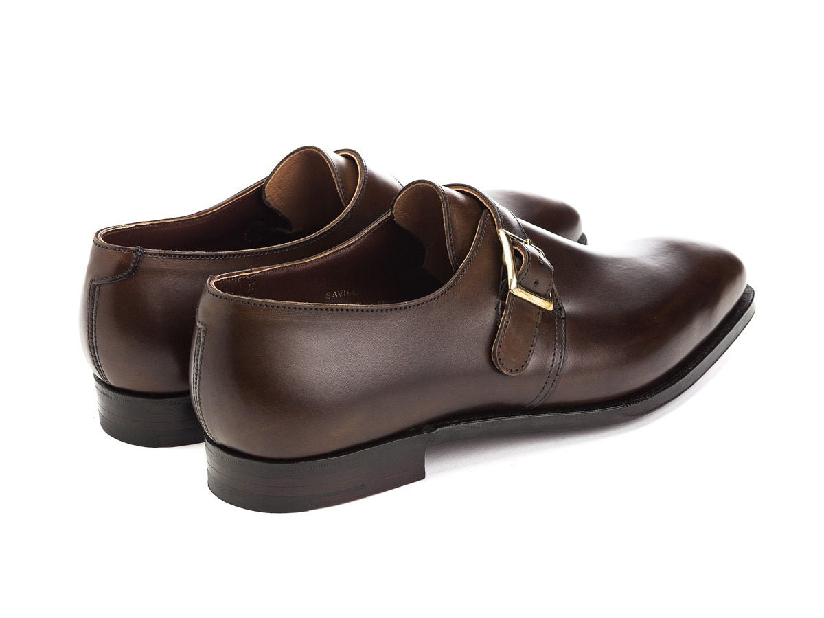 Back angle view of Crockett & Jones Savile plain toe single monk strap shoes in dark brown antique calf