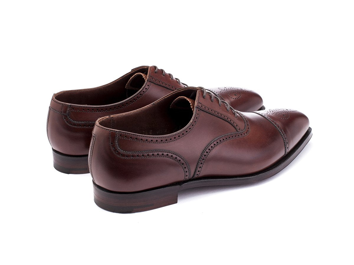 Back angle view of Crockett & Jones Selborne half brogue oxford shoes in chestnut antique calf