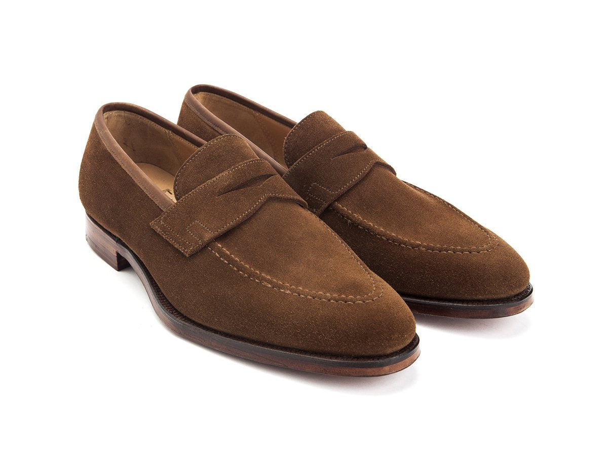 Front angle view of Crockett & Jones Sydney penny loafers in snuff suede