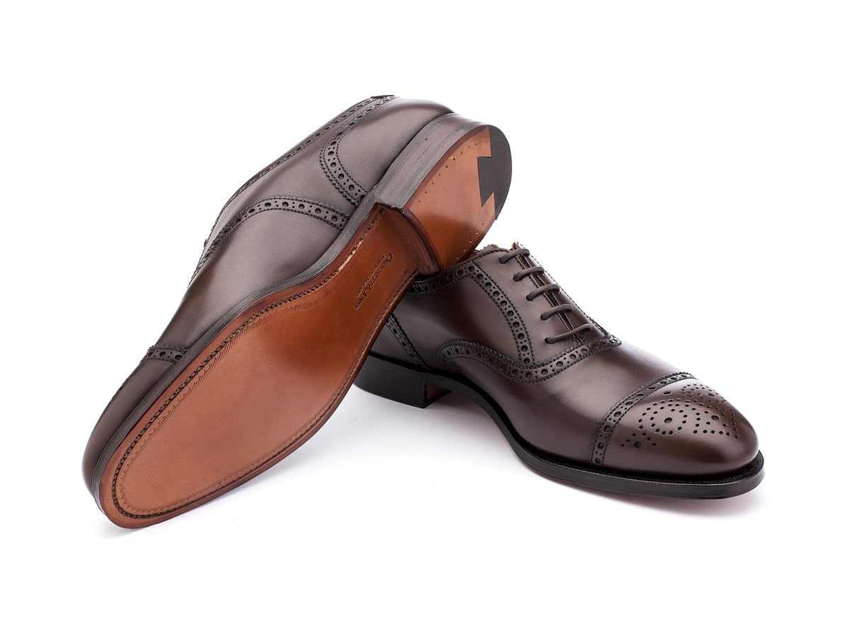 Leather sole of Crockett & Jones Westfield half brogue oxford shoes in dark brown burnished calf