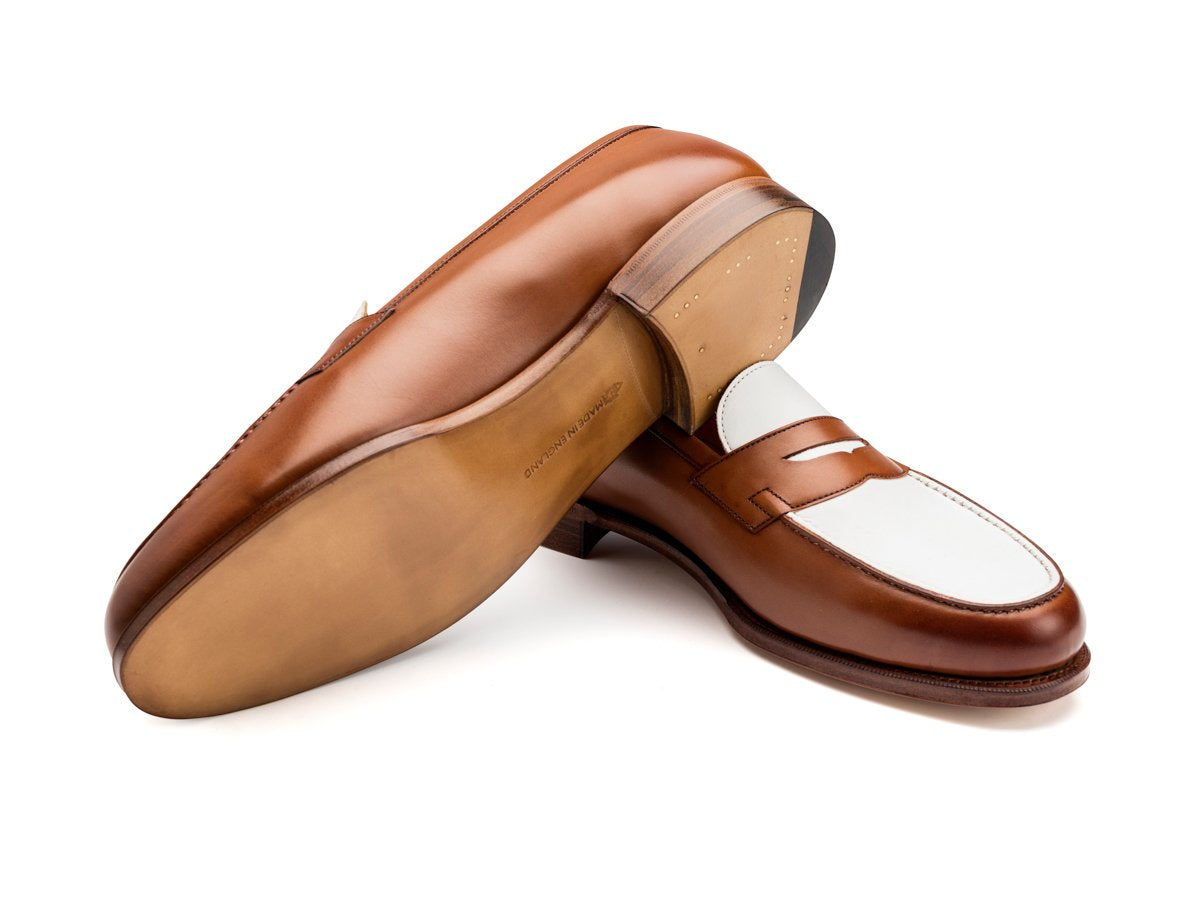 Leather sole of Edward Green Duke spectator penny loafers in hazel and white calf