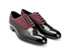 Front angle view of Edward Green Ifford plain toe balmoral oxford shoes in black patent and claret suede
