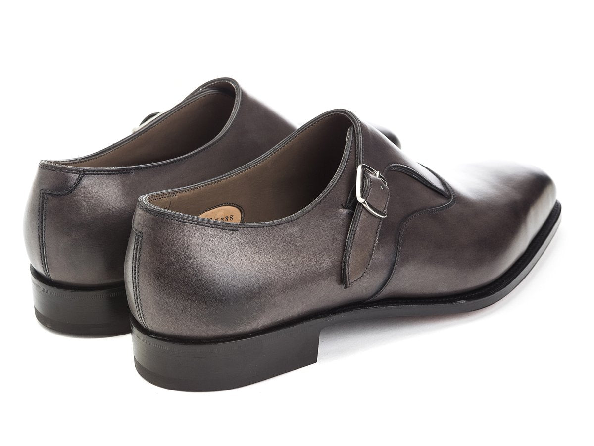 Back angle view of Edward Green Oundle single monk strap shoes in cloud antique calf