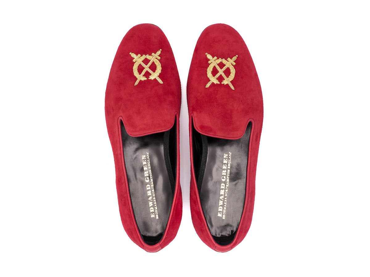 Top view of F width Edward Green Royal Albert slippers in scarlet suede with hand embroidered gold wreath and swords crest on toe