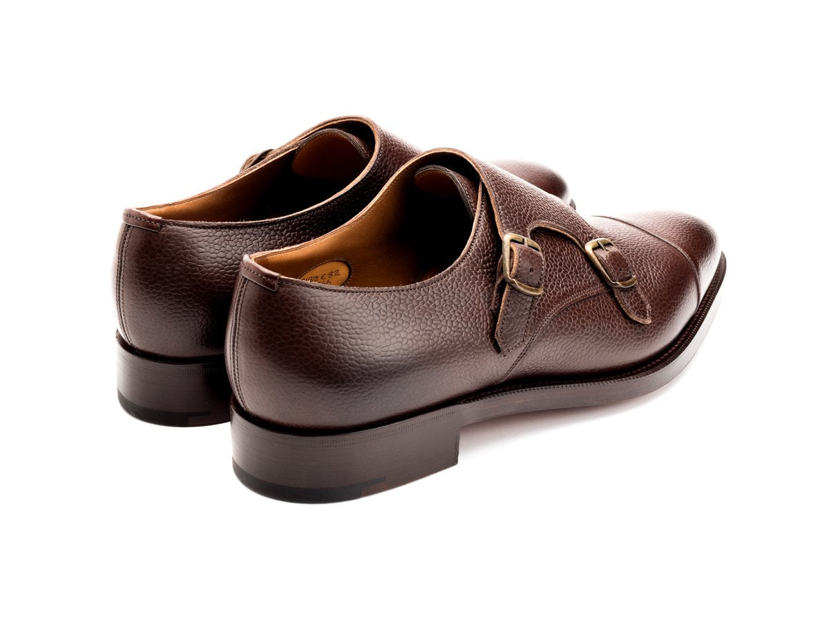 Back angle view of Edward Green Westminster plain captoe double monk strap shoes in walnut country calf