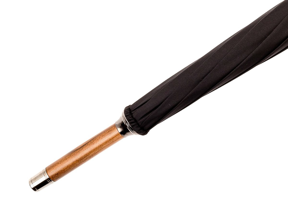 Tip end of solid bark chestnut Fox Umbrella with black canopy