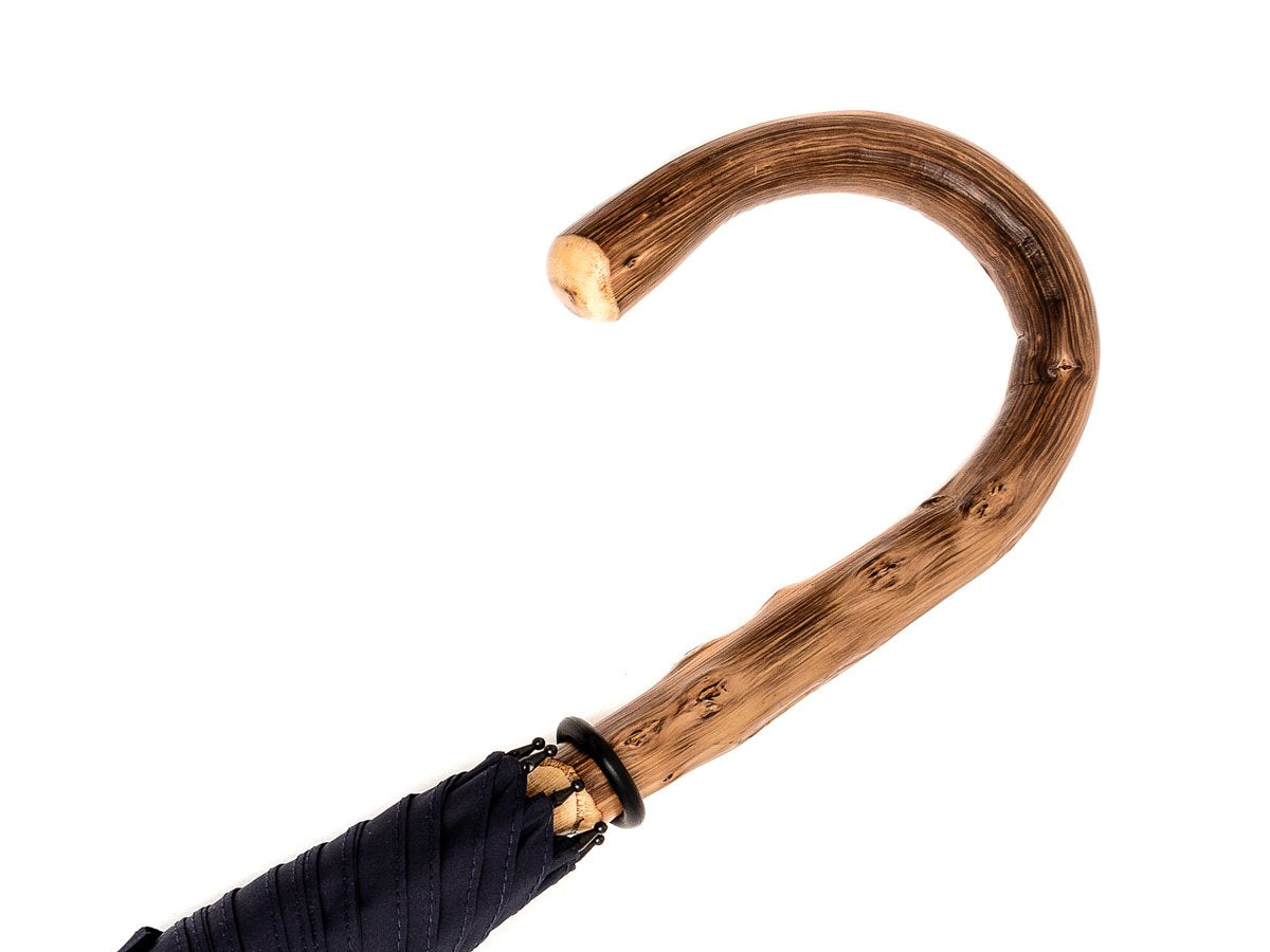 Handle of solid congo Fox Umbrella with navy canopy