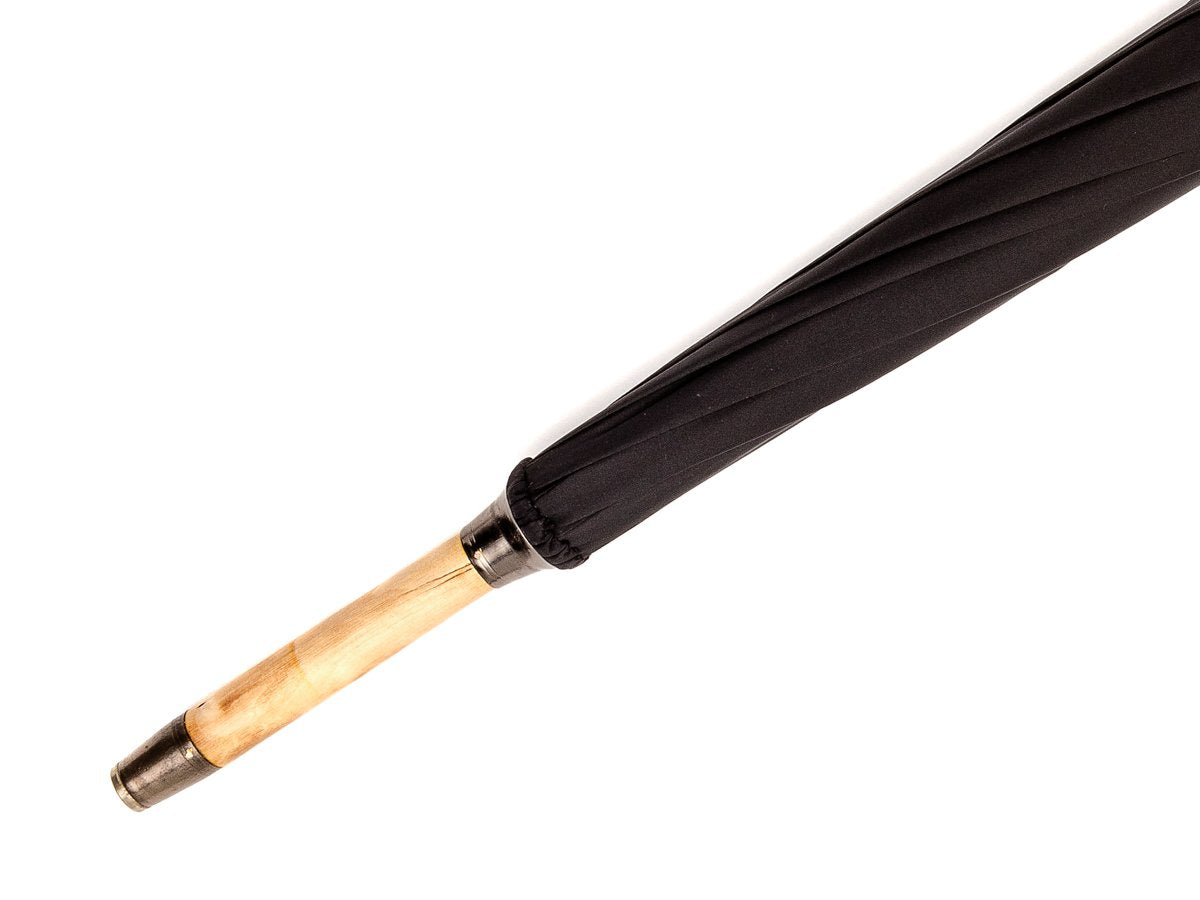 Tip end of solid hazel crook Fox Umbrella with black canopy