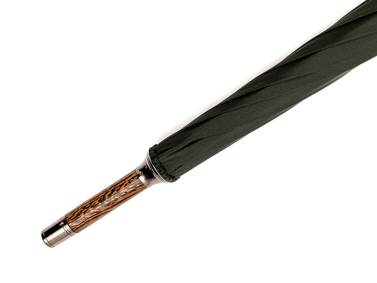Tip end of solid oak Fox Umbrella with dark green canopy