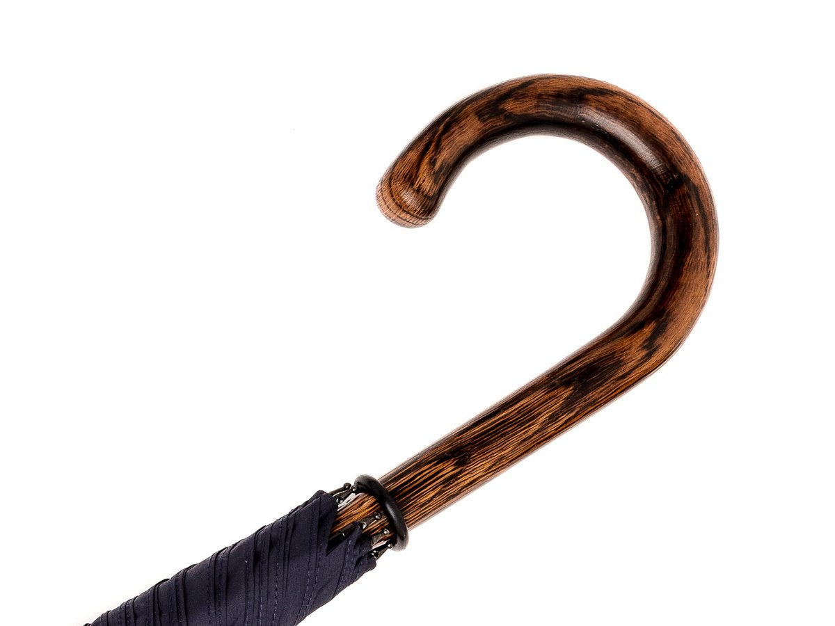 Handle of solid oak Fox Umbrella with navy canopy