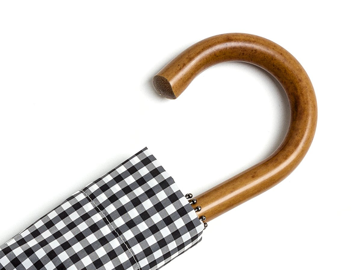 Malacca handle of telescopic Fox Umbrella with black and white gingham canopy cover