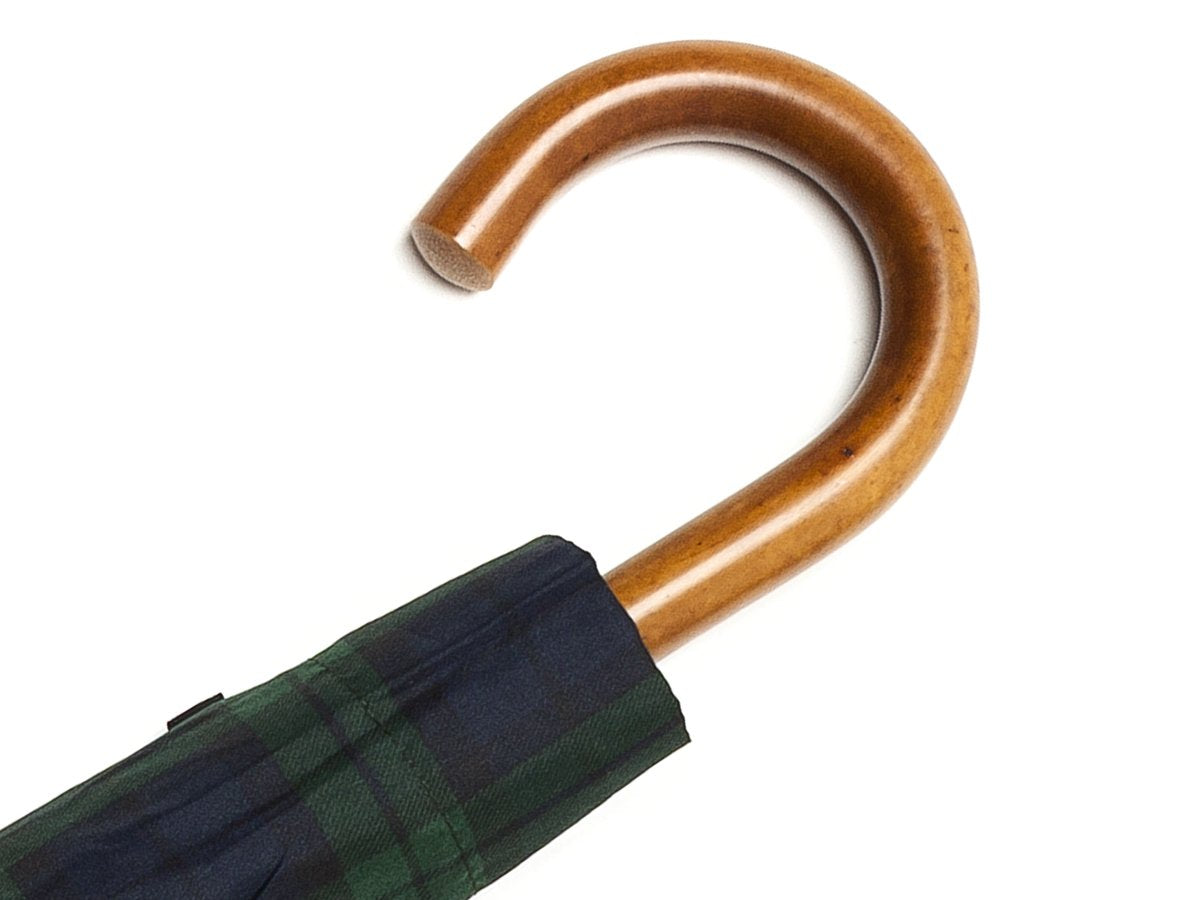 Malacca handle of telescopic Fox Umbrella with black watch tartan canopy cover