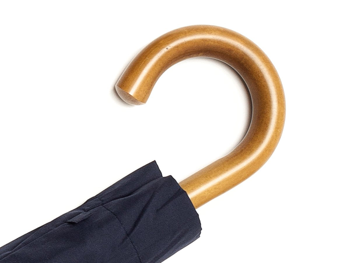 Malacca handle of telescopic Fox Umbrella with navy canopy cover