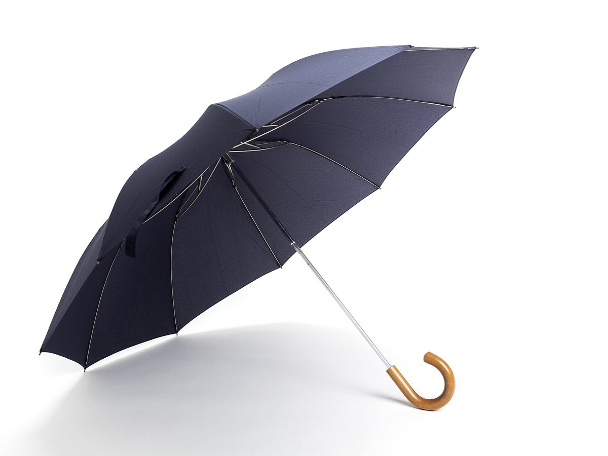 Opened malacca handle telescopic Fox Umbrella with navy canopy