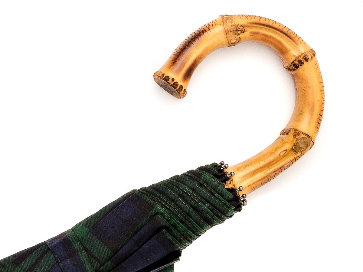 Whangee handle of telescopic Fox Umbrella with black watch tartan canopy