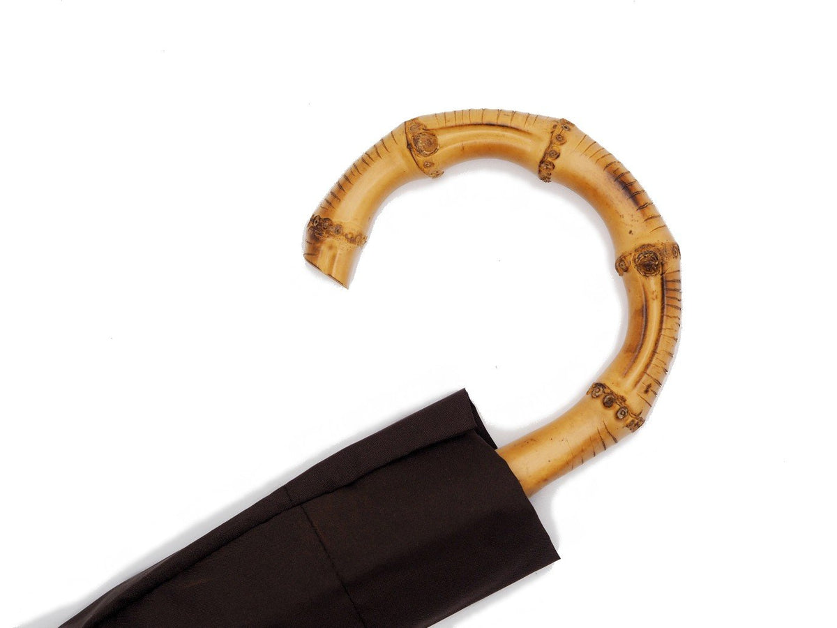 Whangee handle of telescopic Fox Umbrella with brown canopy cover