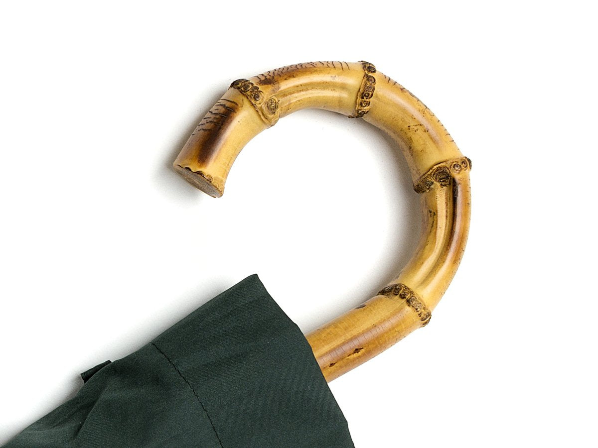 Whangee handle of telescopic Fox Umbrella with dark green canopy cover