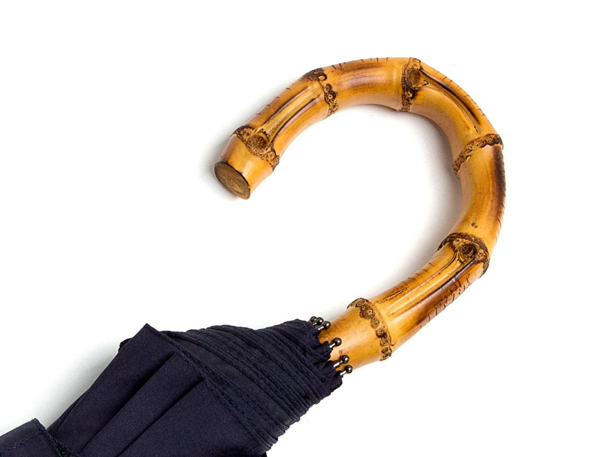 Whangee handle of telescopic Fox Umbrella with navy canopy