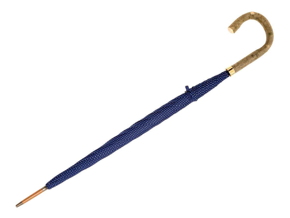 Full length view of ash handle tube Fox Umbrella with navy and white polka dot canopy