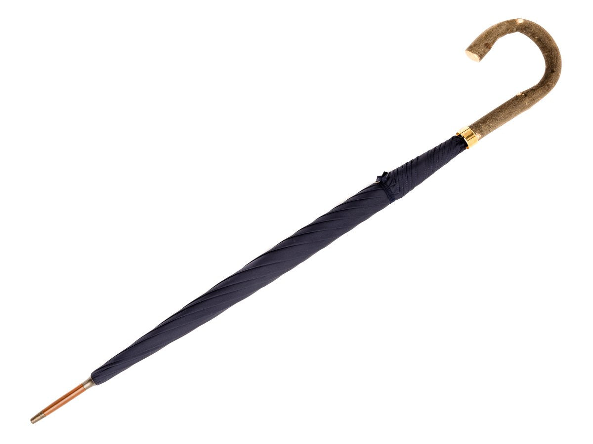 Full length view of ash handle tube Fox Umbrella with navy canopy