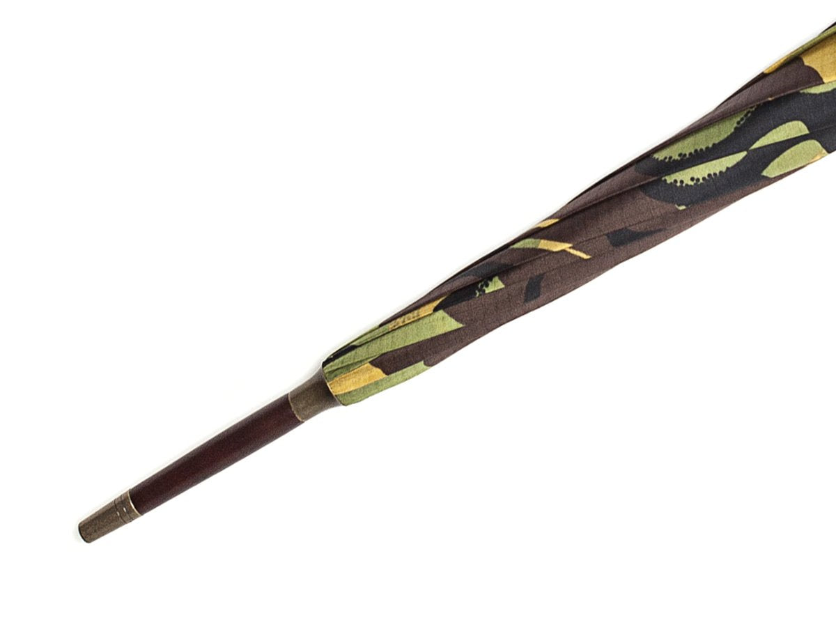 Tip end of dark brown wood handle tube Fox Umbrella with camouflage canopy