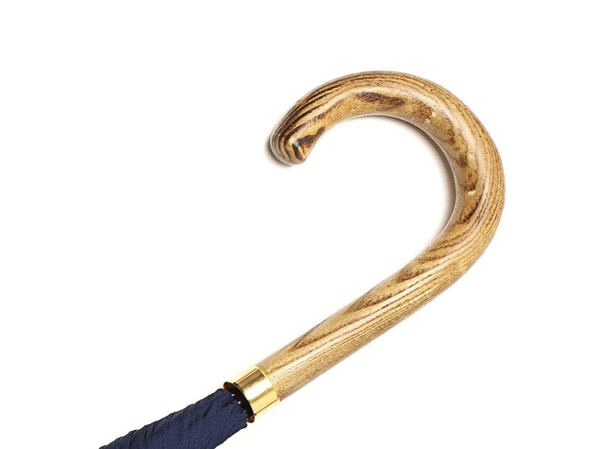 Light grain wood handle of tube Fox Umbrella with navy canopy