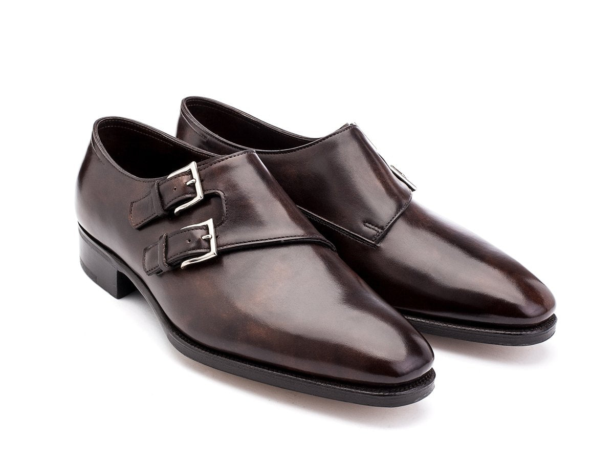 Front angle view of John Lobb Chapel plain toe swept back double monk strap shoes in dark brown museum calf
