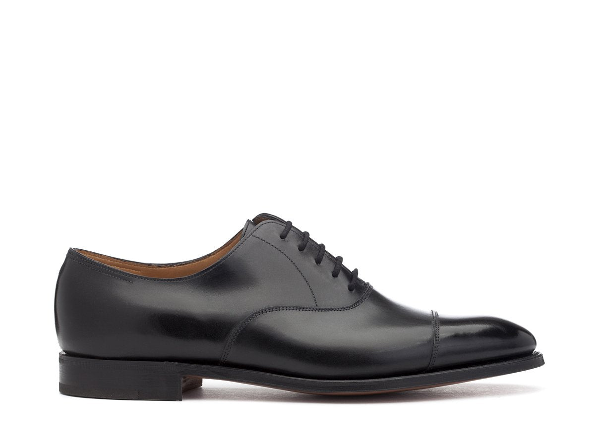 Side view of John Lobb City II plain captoe oxford shoes in black calf