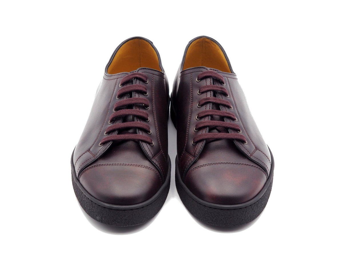 Front view of John Lobb Levah classic tennis sneakers in plum museum calf