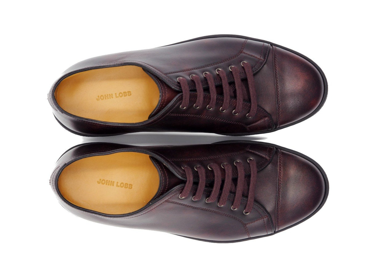 Top view of John Lobb Levah classic tennis sneakers in plum museum calf