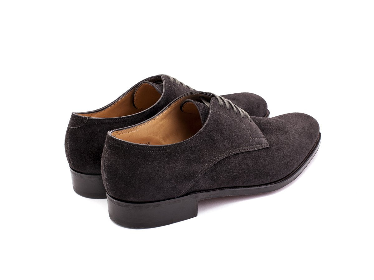 Back angle view of EE width John Lobb Penzance plain toe derby shoes in dark grey suede