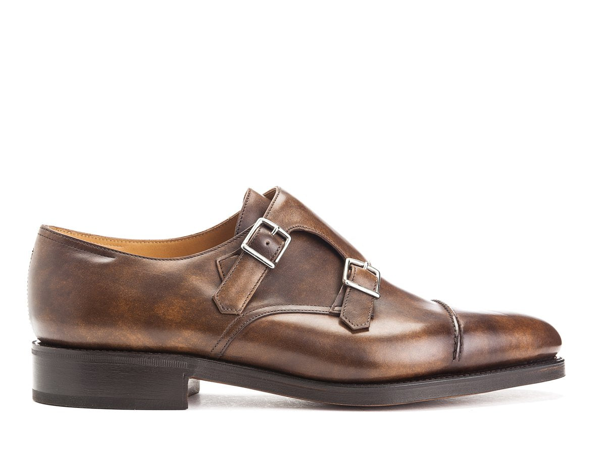 Side view of John Lobb William II captoe double monk strap shoes in parisian brown museum calf
