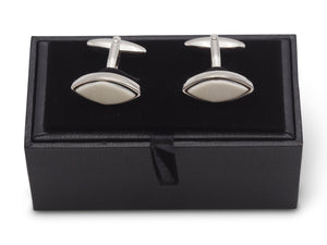 Front view of marquise shaped horn cufflinks sitting on box