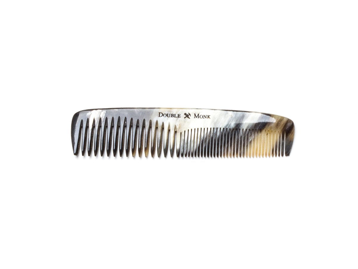Abbeyhorn pocket sized horn hair comb with light dark and light brown variations