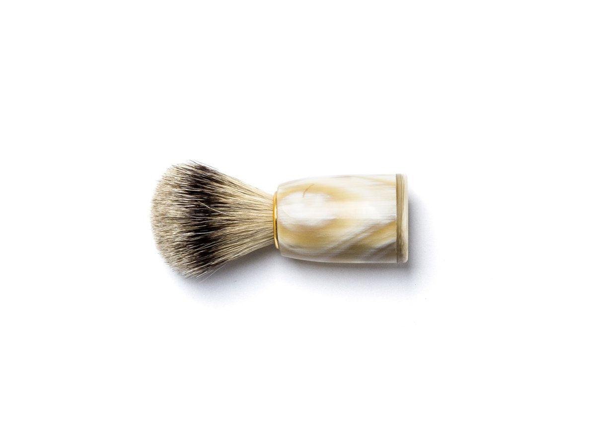 Side view of Abbeyhorn super badger shaving brush with light coloured oxhorn handle