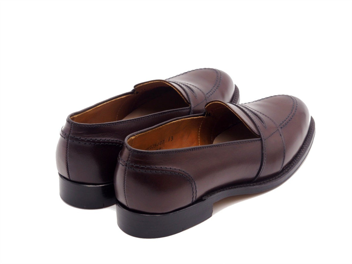 Back angle view of Alden full strap penny loafer in dark brown calf