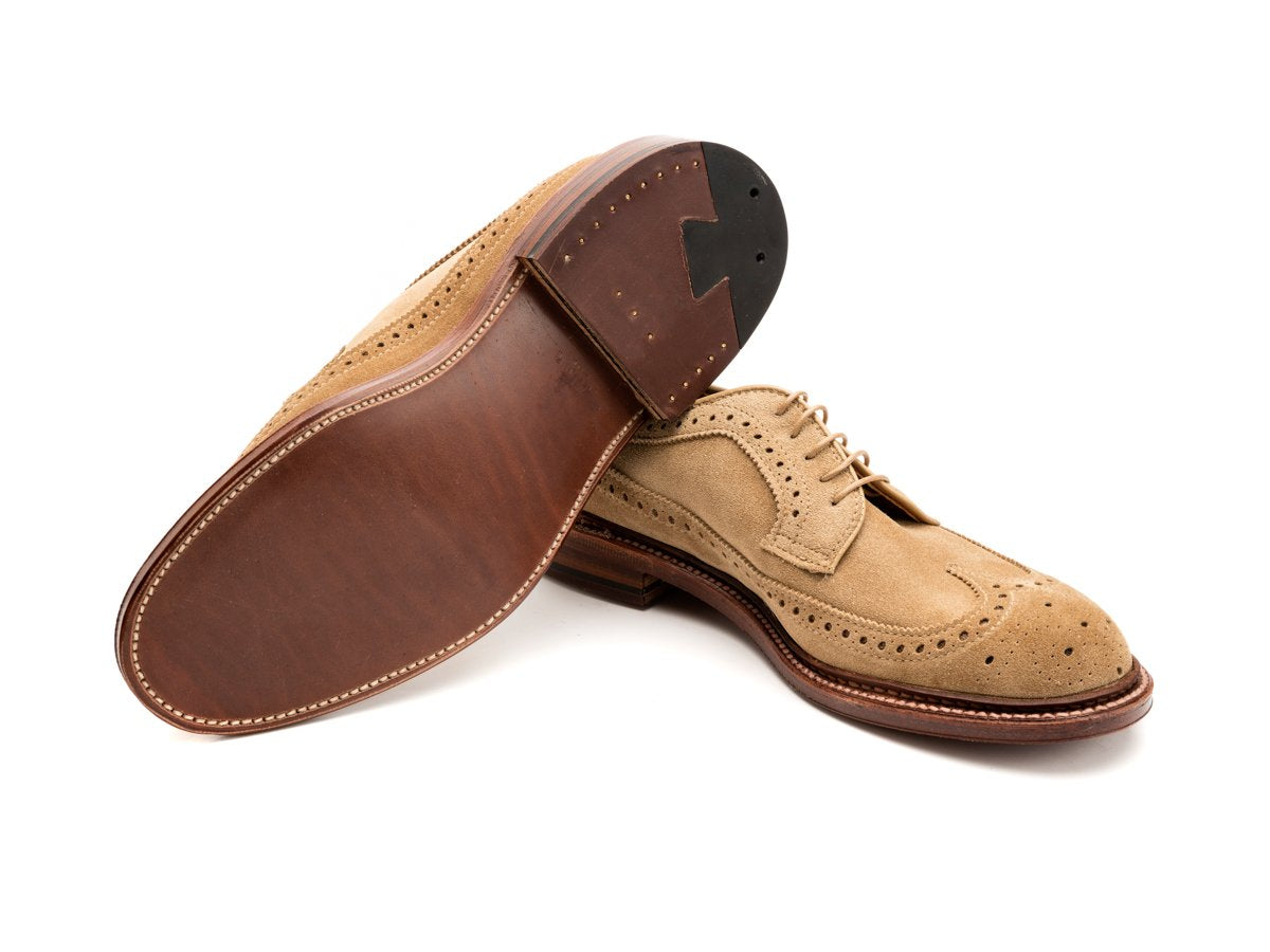 Leather sole of E width Alden longwing blucher shoes in tan suede