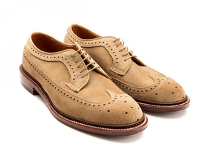 Front angle view of Alden longwing blucher shoes in tan suede