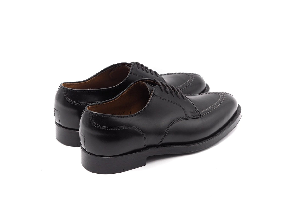 Back angle view of Alden Norwegian split toe blucher shoes in black shell cordovan