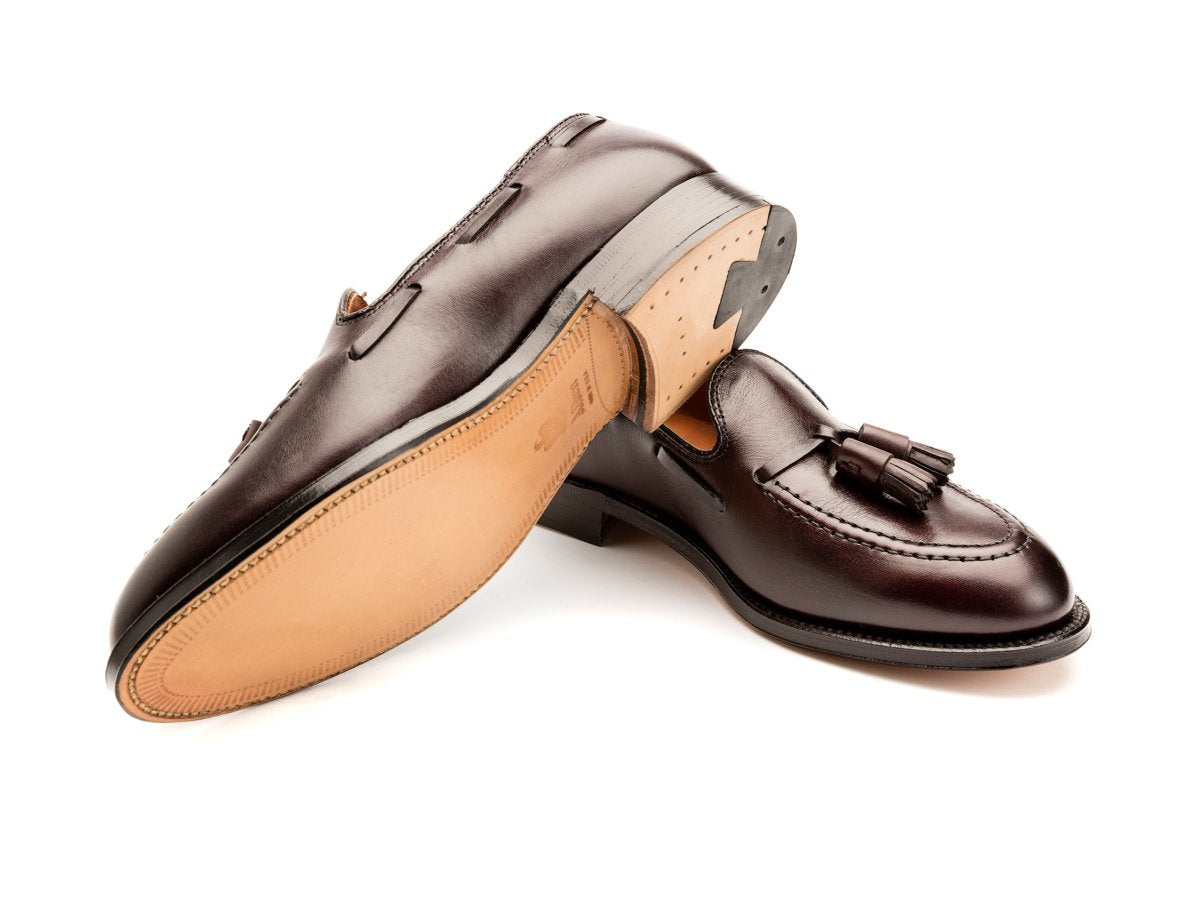 Leather sole of E width Alden tassel moccasin loafer in burgundy calf